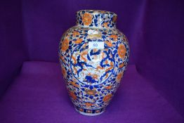 A large Imari palette ginger jar having lid with base having antique restoration 30cm high