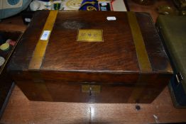 A mahogany cased writers compendium having brass banding and key