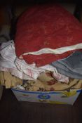 A selection of soft furnishing covers and fabric throws