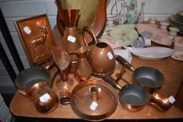 A selection of copper wares including chamber stick and watering can etc
