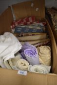A collection of upholstery fabric some larger pieces included
