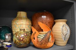 A selection of studio pottery including hand decorated and lava style