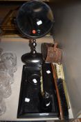 A selection of Ebony dressing table items including a brush set and shaving mirror