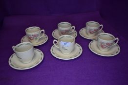 A selection of tea cups and saucers by Susie Cooper