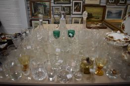 A selection of clear cut wine cordial and whiskey glasses also claret jug