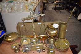 A selection of brass wares including balance scales and warming pans