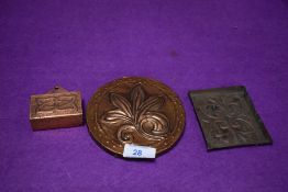 Three pieces of arts and crafts copper hand worked including pin dish and circular plaque