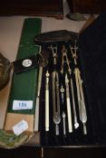A selection of desk top items and stationary including geometry set