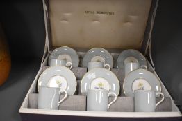 A cased six serving coffee set by Royal Worcester having the Woodland design