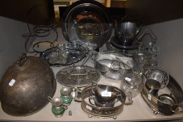 A selection of silver plated items and table wares including cruet set and serving dishes