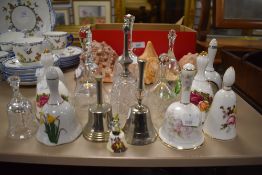 A selection of ceramic and glass door or dinner bells including Royal Albert and Royal Crown Derby