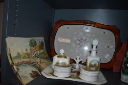 An antique porcelain dressing table set in fine condition hand decorated with cottage scenes with
