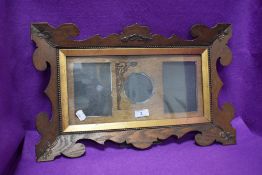 A late Victorian arts and crafts photo frame having copper decals