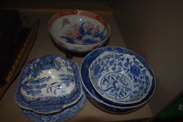 A Chinese style fruit bowl having wooden stand with similar blue and white wears