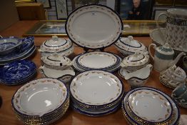 A part tea and dinner service having cobalt and gilt glaze with tureens and soup bowls etc