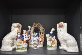 Two Staffordshire flat back dogs and three other similar figural bases