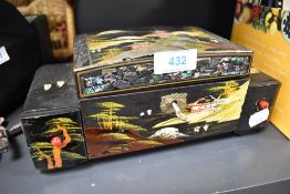 A musical jewellery box having Chinese decoration