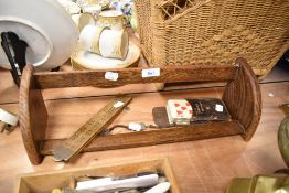 A set of vintage playing cards, a fold out ruler and an oak book trough or shelf