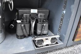 A pair of fold away pocket binoculars and a similar pair by Boots 8x30 with case