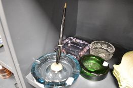 Four ash trays or trinket dishes including moulded, Art Deco pink cut and control bubble pen