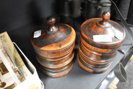 Two hand turned lignum vitae tobacco jars each 14cm tall