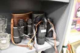 Two pairs of binoculars including Bosche 10x50 and Regent 10x50 both with case