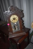 A Victorian stained frame American style mantel clock