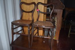 A pair of Victorian mahogany cane seated bedroom chairs