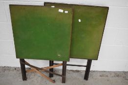 A pair of traditional folding card tables
