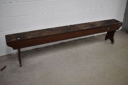 A traditional wooden form bench, length approx. 214cm