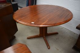 A vintage teak circular dining table, nice quality and interesting design, on quadruple legs,