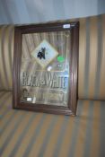 A vintage pub advertising mirror, Black and White Scotch Whisky, approx. 51 x 39cm