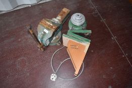 A selection of bench style tools including vice, motor and laithe