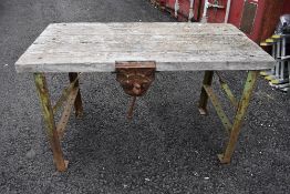 An industrial style cast ended work bench