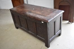 A Period oak kist having carved panels, width approx. 138cm