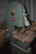 An industrial bandsaw, labelled Perry & Sons/Whitehead