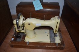 A vintage 1930s Vickers BSM enamelled hand crank sewing machine, in wooden case
