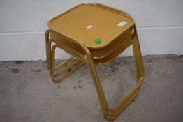 A set of three vintage gilt coloured almuinium occasional tables
