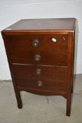 An early 20th Century mahogany four drawer music cabinet