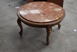 A continental style circular coffee table having rouge marble inset, diameter approx. 80cm