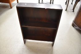 An early 20th Century dark oak low bookshelf, width approx. 60cm