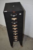 A set of vintage metal filing drawers, on shepherds style casters, 10 drawer, labelled Howden