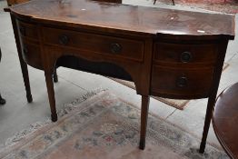 A late 19th Century Regency Revival mahogany sideboard, having tapered legs, satinwood inlay