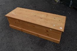 A natural pine bedding box, approx dimensions 140 x 50 x 40cm