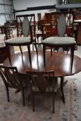 A reproduction Regency dining table and set of six (four plus two) dining chairs having green dralon