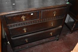 An early 20th Century oak bedroom chest of two over two drawers, width approx. 94cm