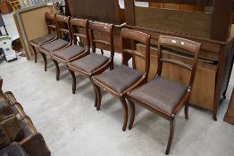 A set of six Victorian mahogany dining chairs having twist rail back