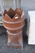 A traditional glazed crown top chimney pot