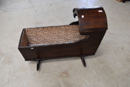 A 19th Century oak rocking crib/cot, later lining