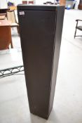 A metal gun cabinet, dimensions approx. 122 x 25 x 20cm (with key, side locks)